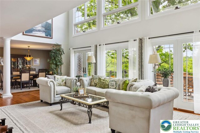 2965 Adams Way, Springfield Twp, PA 18077 - living room featuring a high ceiling and ornate columns