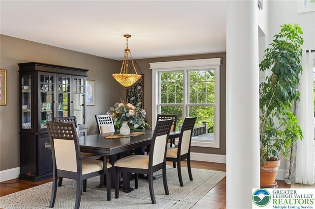 2965 Adams Way, Springfield Twp, PA 18077 - dining space featuring ornate columns, baseboards, and wood finished floors