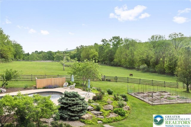 2965 Adams Way, Springfield Twp, PA 18077 - view of yard with a vegetable garden, a view of countryside, and a patio