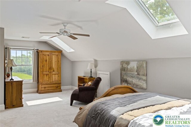 2965 Adams Way, Springfield Twp, PA 18077 - bedroom featuring a skylight, vaulted ceiling, carpet, baseboards, and a ceiling fan
