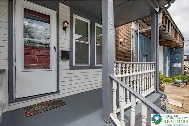 1123 Spruce St, Easton, PA 18042 - property entrance featuring a porch and brick siding