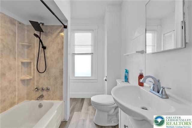 1123 Spruce St, Easton, PA 18042 - full bathroom featuring healthy amount of natural light, washtub / shower combination, toilet, and wood finished floors
