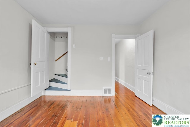 1123 Spruce St, Easton, PA 18042 - spare room featuring hardwood / wood-style flooring, stairs, and baseboards