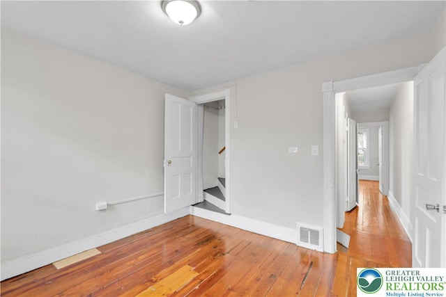 1123 Spruce St, Easton, PA 18042 - unfurnished room featuring hardwood / wood-style flooring, baseboards, and stairway