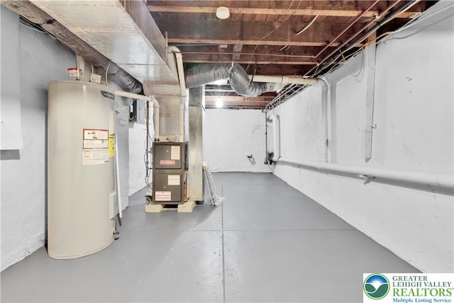 1123 Spruce St, Easton, PA 18042 - unfinished below grade area with electric water heater and heating unit