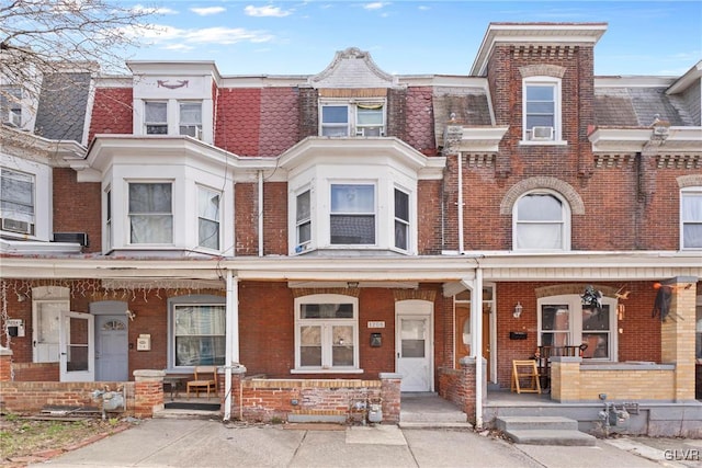 1208 Union St, Allentown City, PA 18102 - townhome / multi-family property with covered porch, brick siding, and mansard roof