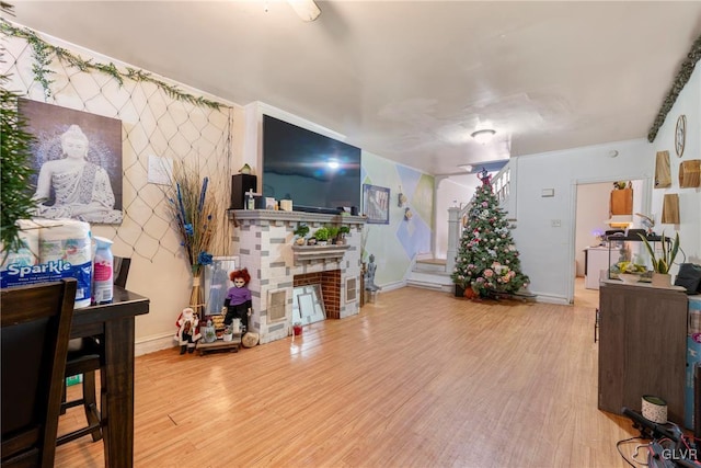 1208 Union St, Allentown City, PA 18102 - living room with wood finished floors, stairs, a fireplace, and baseboards