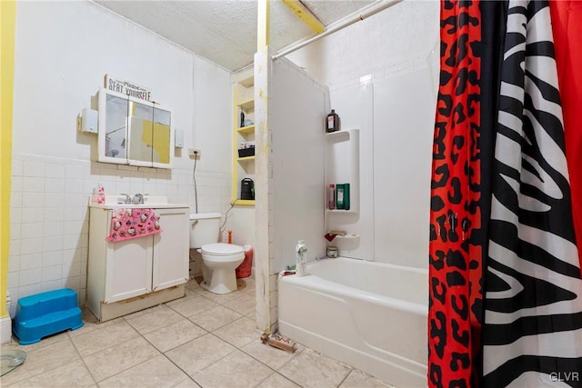 1208 Union St, Allentown City, PA 18102 - bathroom featuring tile walls, toilet, tile patterned floors, vanity, and shower / bath combination with curtain