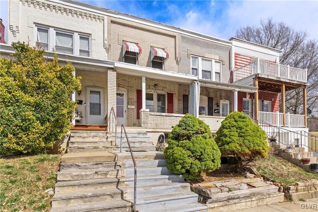 521 S Bradford St, Allentown City, PA 18109 - view of property with brick siding, covered porch, and stairway
