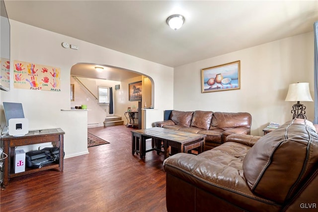 521 S Bradford St, Allentown City, PA 18109 - living area featuring arched walkways, dark wood finished floors, a baseboard radiator, baseboards, and stairs