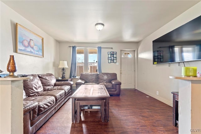 521 S Bradford St, Allentown City, PA 18109 - living room with wood finished floors, a fireplace, and baseboards