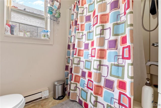521 S Bradford St, Allentown City, PA 18109 - bathroom featuring a baseboard heating unit, a shower with curtain, and toilet