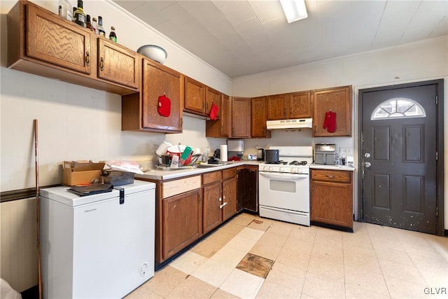 526 N Law St, Allentown City, PA 18102 - kitchen featuring white appliances, under cabinet range hood, light countertops, brown cabinets, and ornamental molding