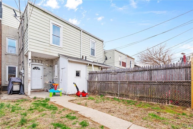 526 N Law St, Allentown City, PA 18102 - back of property featuring a fenced backyard and brick siding