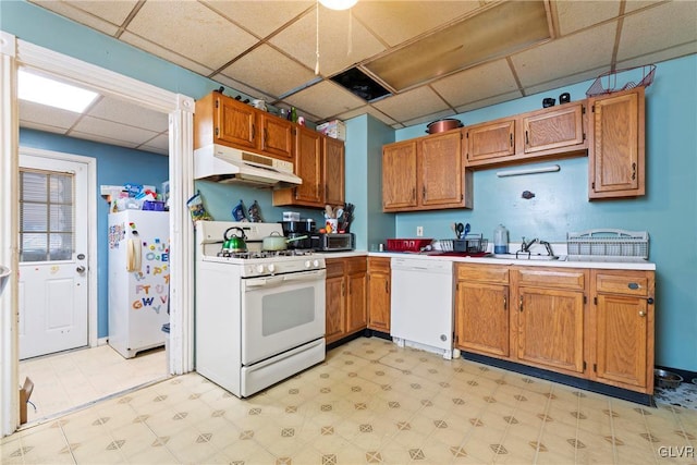 117 S 15th St, Wilson Borough, PA 18042 - kitchen with white appliances, under cabinet range hood, a drop ceiling, light floors, and light countertops