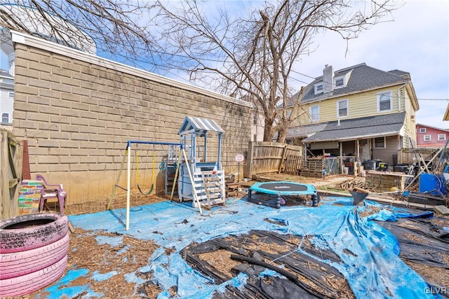 117 S 15th St, Wilson Borough, PA 18042 - rear view of house featuring a playground and a fenced backyard
