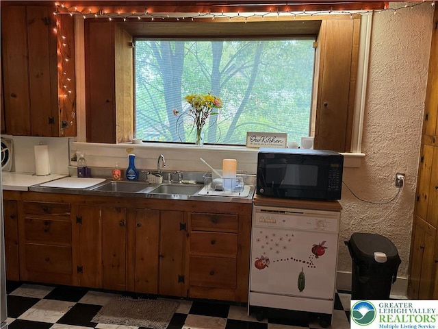 204 Analomink St, East Stroudsburg, PA 18301 - kitchen featuring white dishwasher, black microwave, a sink, plenty of natural light, and a textured wall