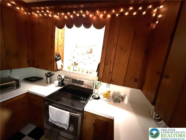 204 Analomink St, East Stroudsburg, PA 18301 - kitchen featuring stainless steel range with electric cooktop, light countertops, and brown cabinets