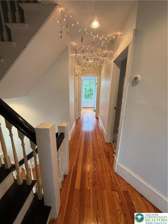 204 Analomink St, East Stroudsburg, PA 18301 - corridor featuring baseboards, light wood-style flooring, and stairs