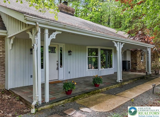 711 E Center St, Nesquehoning Borough, PA 18240 - doorway to property with covered porch and a chimney
