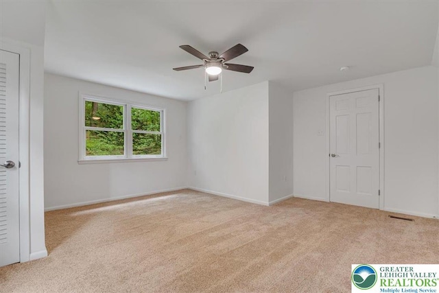 711 E Center St, Nesquehoning Borough, PA 18240 - unfurnished room featuring carpet, a ceiling fan, and baseboards