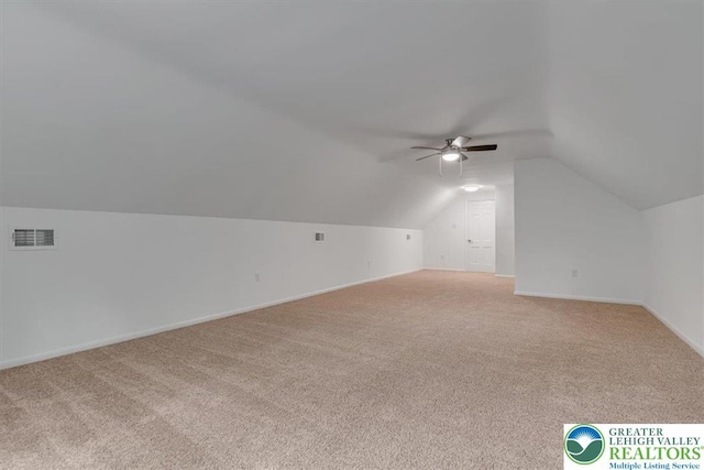 711 E Center St, Nesquehoning Borough, PA 18240 - additional living space featuring light carpet, a ceiling fan, lofted ceiling, and baseboards