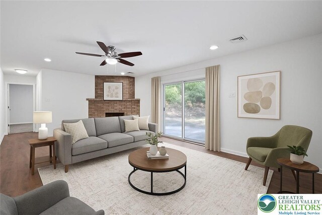 711 E Center St, Nesquehoning Borough, PA 18240 - living room with wood finished floors, ceiling fan, baseboards, a fireplace, and recessed lighting