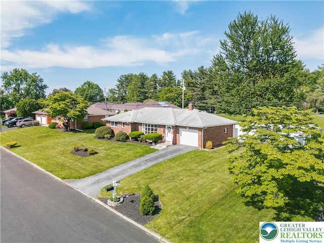 929 Webster Ave, Allentown City, PA 18103 - single story home with an attached garage, driveway, a front yard, brick siding, and a chimney