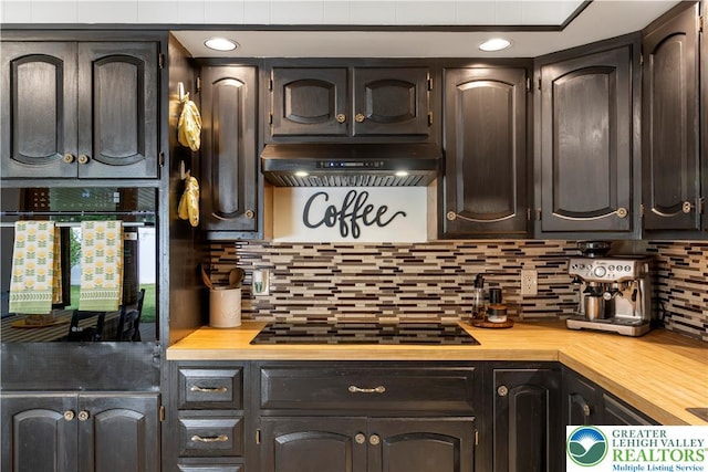 929 Webster Ave, Allentown City, PA 18103 - kitchen featuring under cabinet range hood, black appliances, decorative backsplash, and butcher block countertops