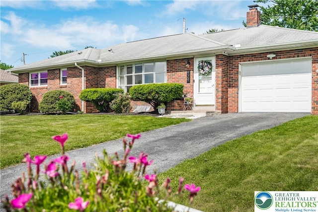 929 Webster Ave, Allentown City, PA 18103 - single story home with driveway, a garage, a chimney, brick siding, and a front yard