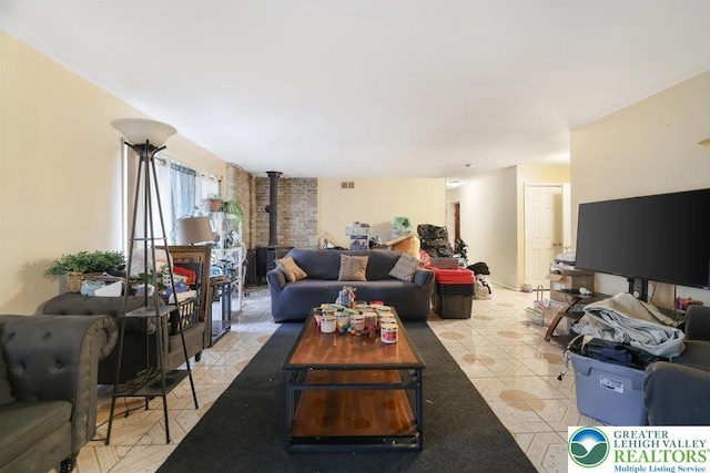 4754 Brentwood Dr, Tobyhanna Twp, PA 18466 - living room with a wood stove and light tile patterned floors