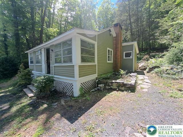 1392 Cherrylane Rd, Stroud Twp, PA 18301 - view of property exterior with a chimney
