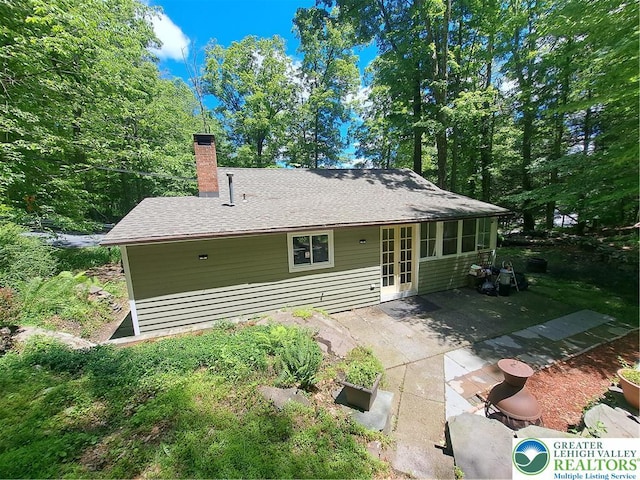 1392 Cherrylane Rd, Stroud Twp, PA 18301 - rear view of property with a patio area, a chimney, roof with shingles, and french doors