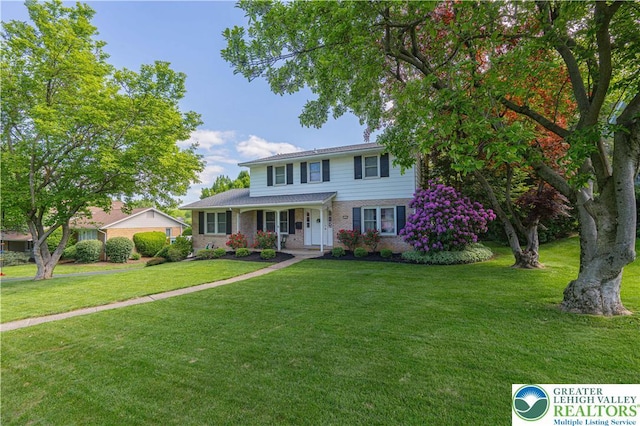1131 28th St, Allentown City, PA 18104 - traditional home featuring a front lawn and brick siding