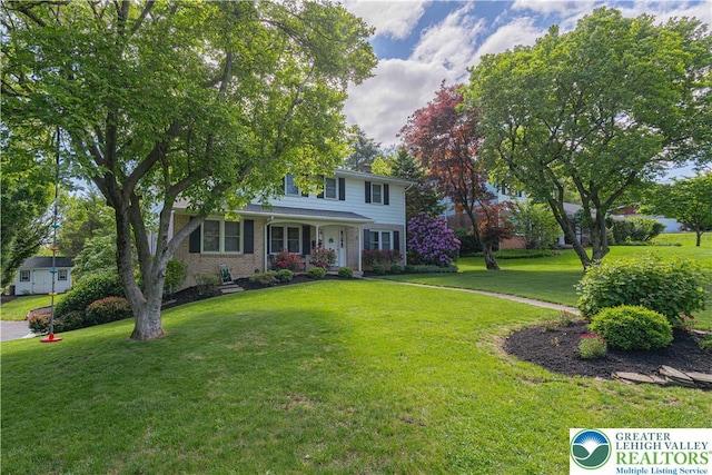 1131 28th St, Allentown City, PA 18104 - view of front of house featuring a front lawn and brick siding
