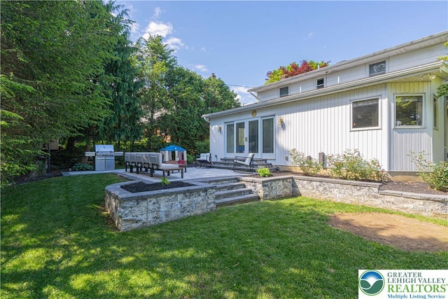 1131 28th St, Allentown City, PA 18104 - view of grassy yard with french doors and a patio area