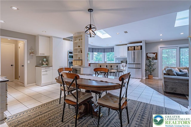 1131 28th St, Allentown City, PA 18104 - dining room featuring a skylight, light tile patterned flooring, recessed lighting, baseboards, and wine cooler