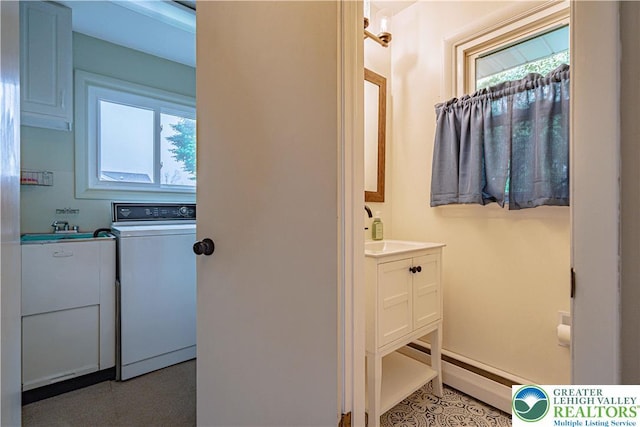 1131 28th St, Allentown City, PA 18104 - bathroom featuring washer / dryer, vanity, plenty of natural light, and tile patterned floors