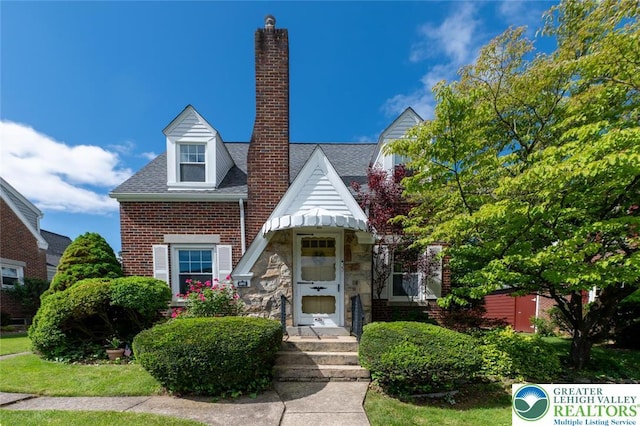 550 N 2nd St, Emmaus Borough, PA 18049 - view of front of home featuring a chimney, stone siding, and brick siding