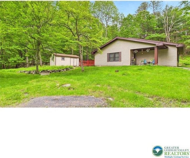 108 Abbey Ln, Lehman Twp, PA 18302 - view of green lawn with view of wooded area