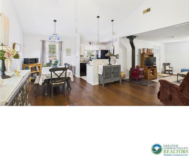 108 Abbey Ln, Lehman Twp, PA 18302 - dining area with a wood stove and dark wood finished floors