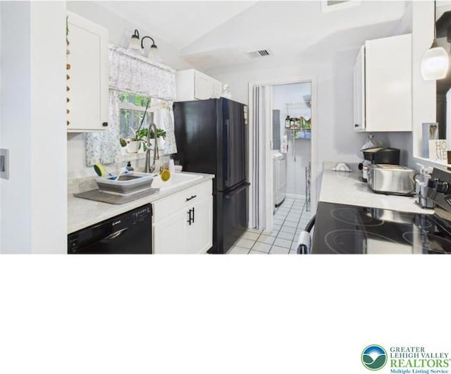 108 Abbey Ln, Lehman Twp, PA 18302 - kitchen with black appliances, light countertops, white cabinets, lofted ceiling, and light tile patterned floors