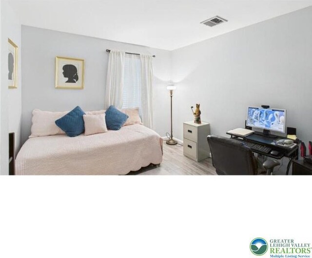 108 Abbey Ln, Lehman Twp, PA 18302 - bedroom with a desk and light wood-style flooring