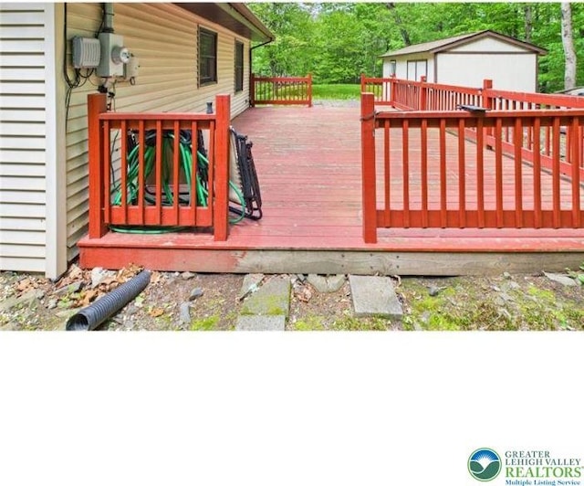 108 Abbey Ln, Lehman Twp, PA 18302 - wooden terrace featuring an outdoor structure