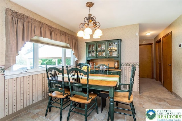 217 26th St, Allentown City, PA 18104 - dining area with wallpapered walls, a chandelier, and mail area