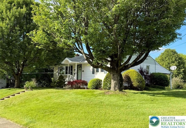 217 26th St, Allentown City, PA 18104 - view of property hidden behind natural elements with a front lawn