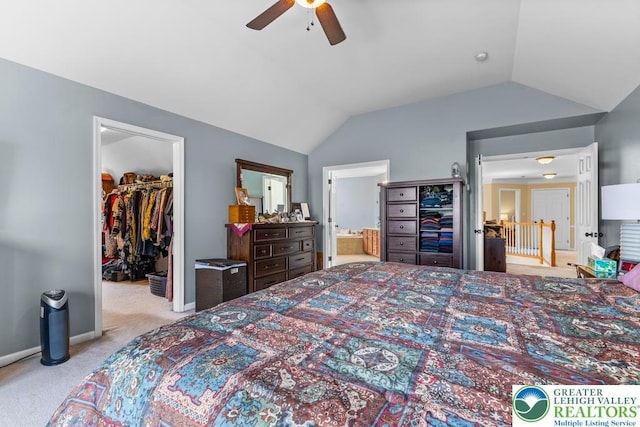 140 Birdie Way, Eldred Twp, PA 18058 - bedroom with a spacious closet, carpet flooring, lofted ceiling, connected bathroom, and ceiling fan