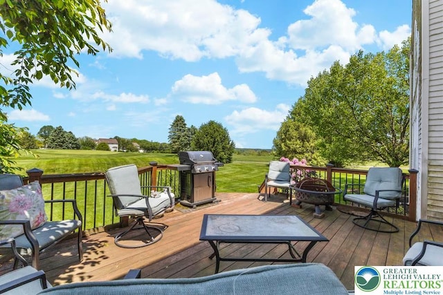 140 Birdie Way, Eldred Twp, PA 18058 - wooden terrace with area for grilling, an outdoor fire pit, and a lawn