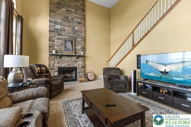 140 Birdie Way, Eldred Twp, PA 18058 - carpeted living room featuring a fireplace and a high ceiling