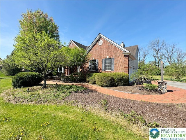 4620 Graystone Dr, Lower Nazareth Twp, PA 18064 - view of front facade with brick siding and a chimney
